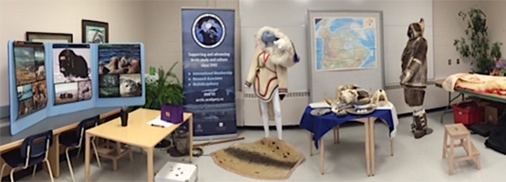 Inuit artifacts, and Arctic posters and images on display.